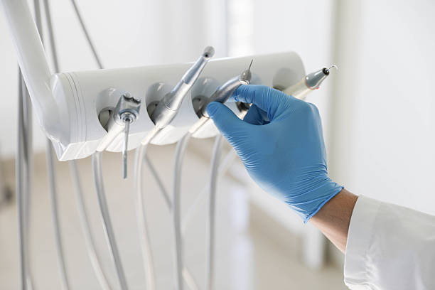 Professional Tooth Extraction technician working in Portland, MI